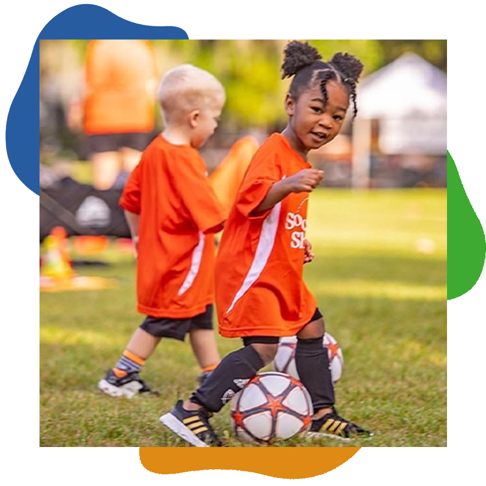 Preschool Child playing soccer.